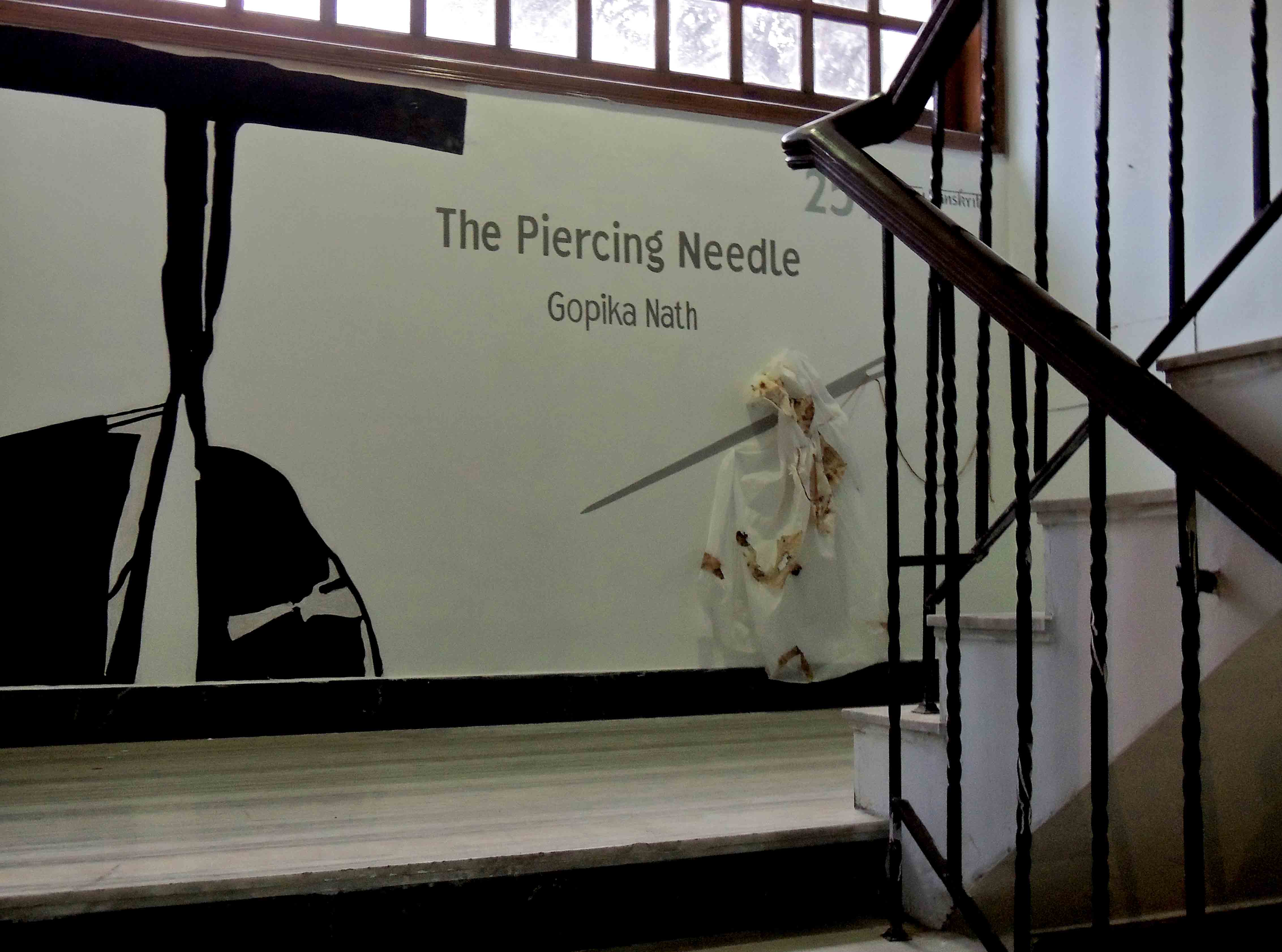 Image 3 : Display image of The Piercing Needle, In View: Display on staircase leading up to gallery, Photo credit: gopika nath