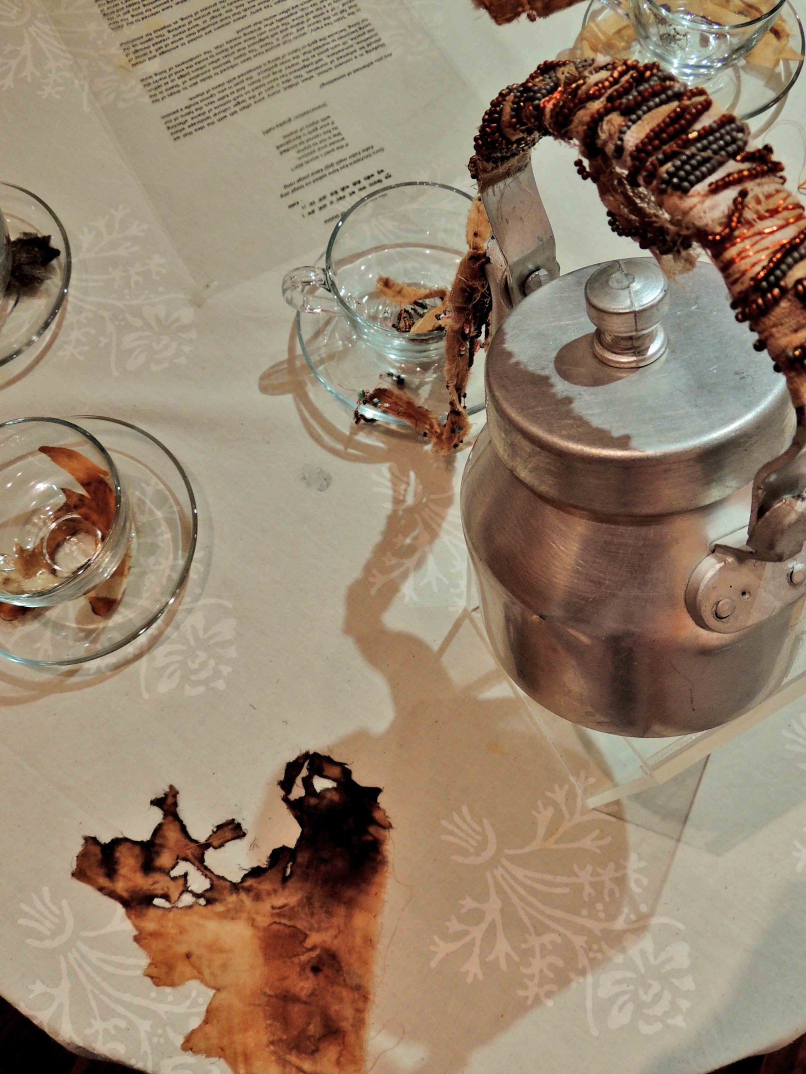 Image 6 : Display image of The Piercing Needle, Work in view: Detailed view of The Stain Tea Party, Installation, Photo credit: gopika nath