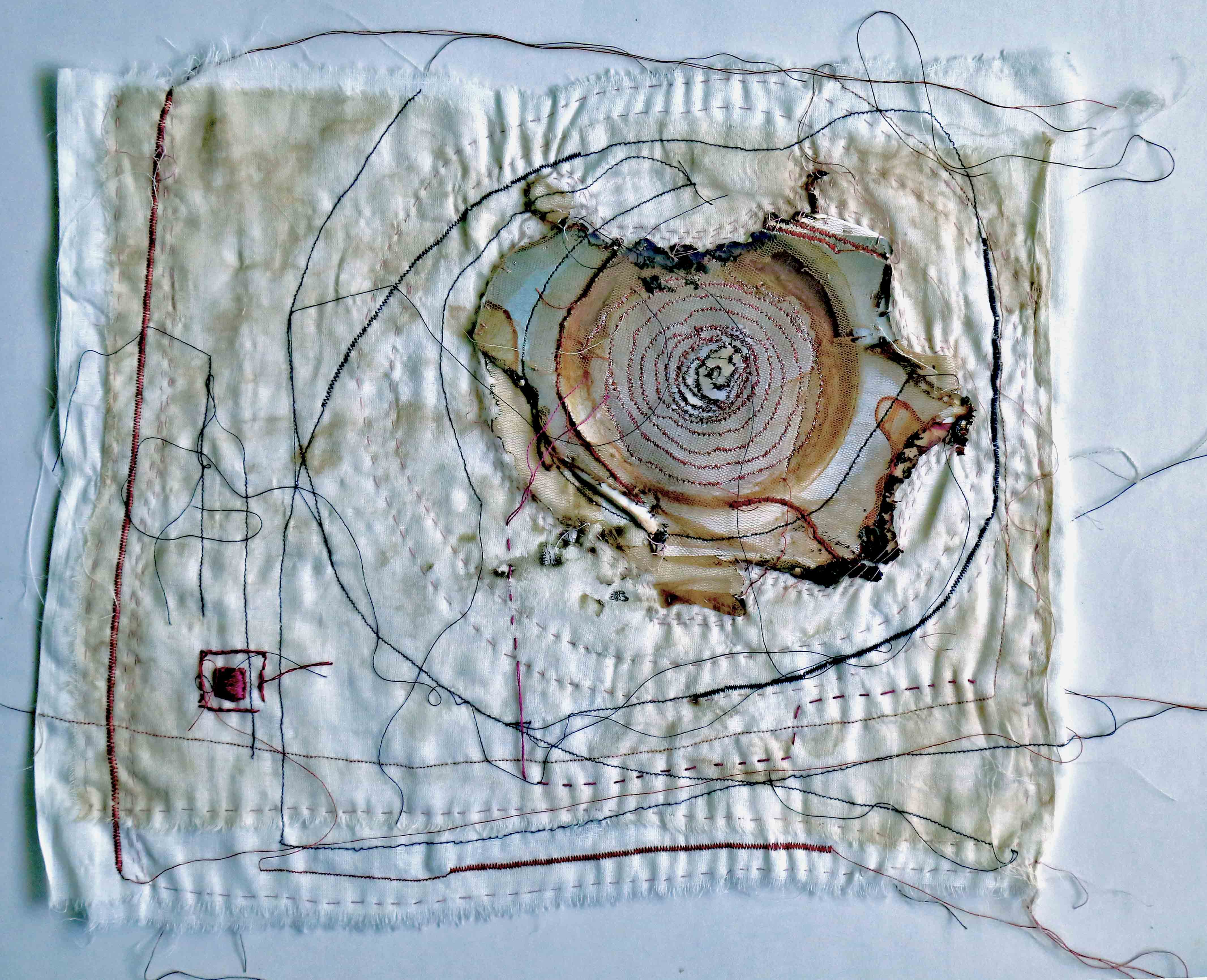 Memory Spiral, 2015, [10 x 12 inches – unframed, set of three], Materials: photographic paper, cotton fabrics, cotton floss cotton-polyester thread, Technique: burning, layering, hand-sewing, machine embroidery, staining with tea-leaves