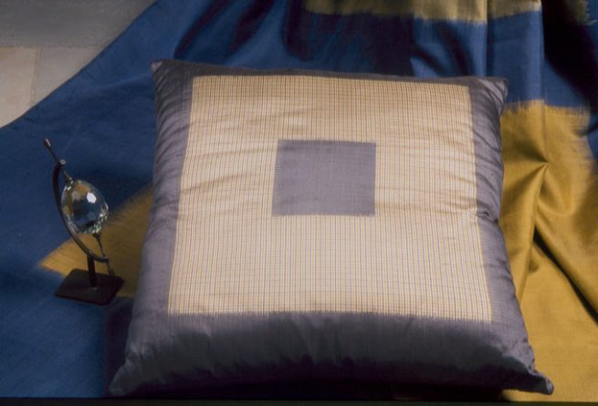 Double Ikat silk cushion cover and bedspread; made in Pochampally.